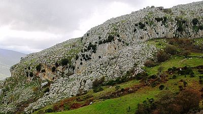 View on rocky outcrops in green meadows.