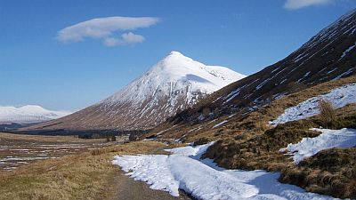 Springtime moorland landscape with patches of snow and a mountain in the background. Original photo http://commons.wikimedia.org/wiki/File:On_the_West_Highland_Way_-_geograph.org.uk_-_176411.jpg