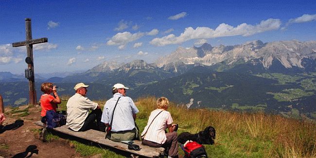 Walkers enjoying a break during a walking holiday in the Dachstein mountains in Austria