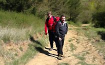 two men hiking up a mountain track