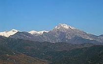 View towards snow-capped mountains in Liguria, Italy.