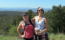 Two female hikers happily posing for a photo