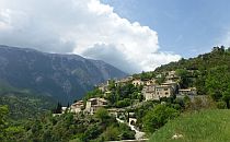 Houses on a green hill