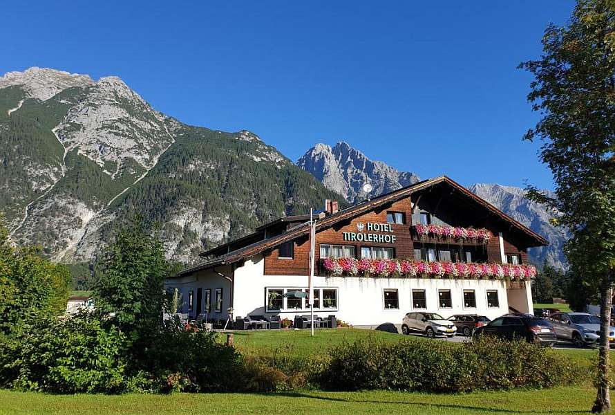 Beautiful hotel building with a rocky mount in the background