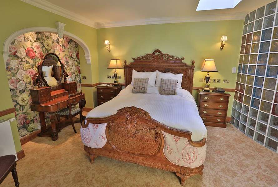 King size bed in a beautiful bedroom