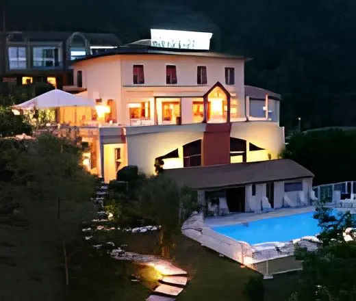Hotel at night with swimming pool