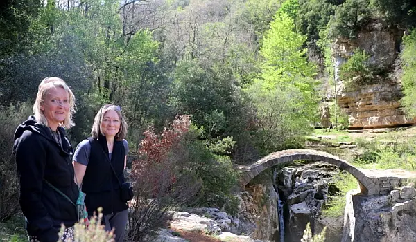 Woman lying on a large stone