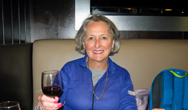 Female hiker drinking a glass of French wine