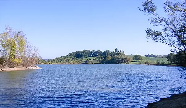Lakeside view with small ripples on blue water