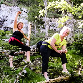 A pair of female hikers on the side of a hill