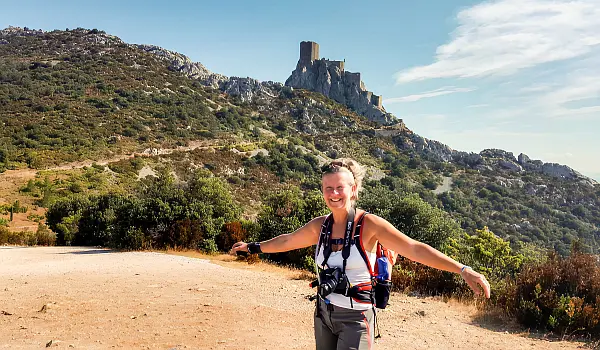 Woman hiking through easy to moderate terrain in the Razes area of France